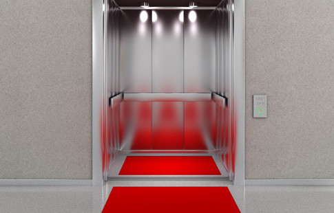 open elevator with red carpet